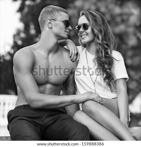 young couple with sunglasses outdoors