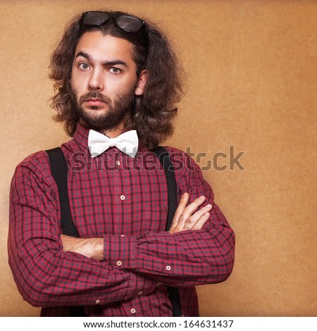 Portrait of handsome long-haired stylish man. Hipster style