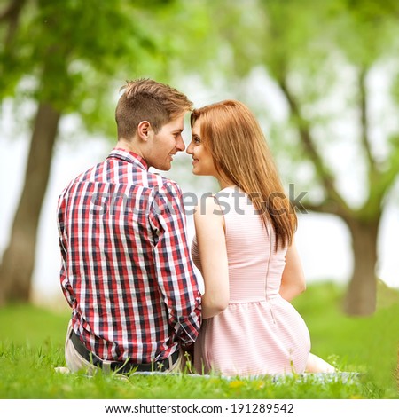 Couple in love in sitting near the river, picnic . Valentine\'s Day