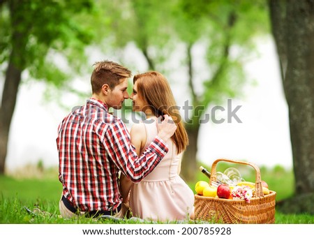 Couple in love in sitting near the river, picnic . Valentine's Day