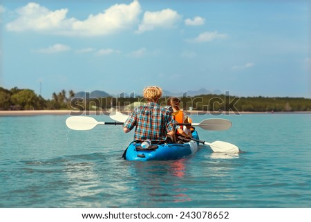 family in sea kayak