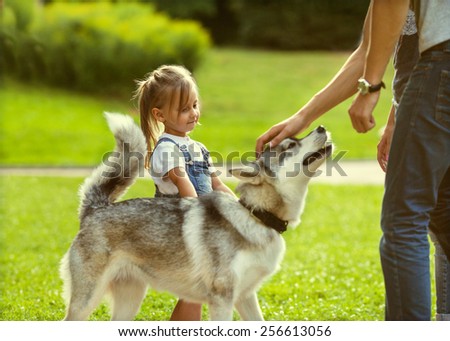 family with a dog in the park