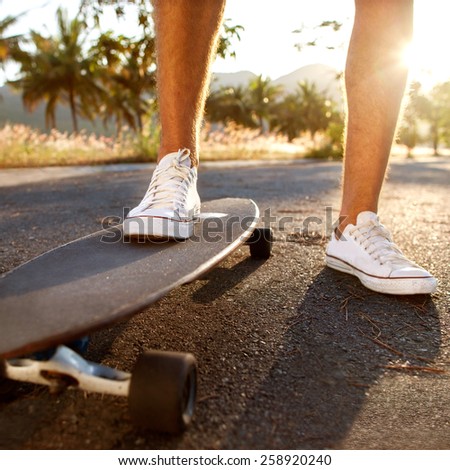 guy on skateboard at sunset