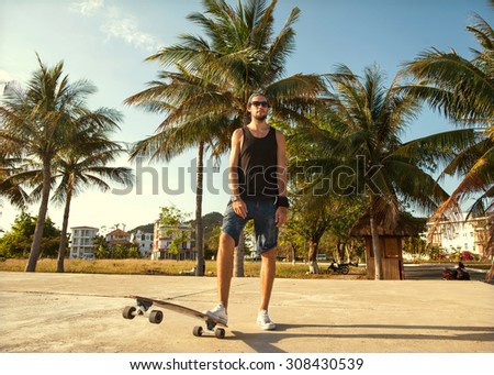 guy skateboard at sunset