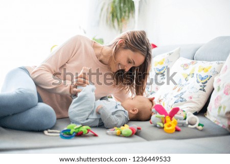 Similar – Image, Stock Photo Kid grabs his toy Child