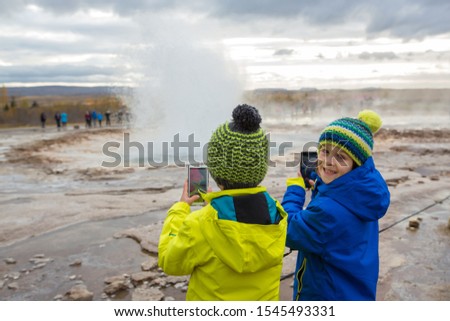 Similar – Image, Stock Photo Large geyser on Iceland surrounded by lava cliffs