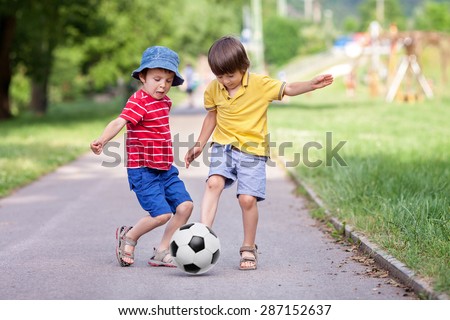 Similar – Image, Stock Photo Two children playing with their mobile on the beach