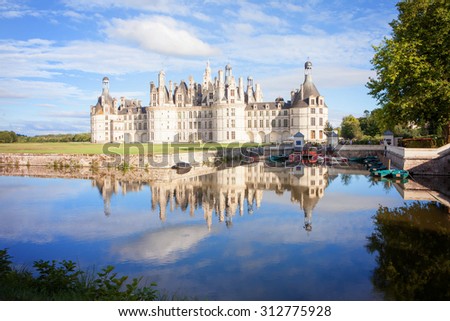 Chateau de Chambord, royal medieval french castle with reflection in the water canal in front of it at Loire Valley, France, Europe
