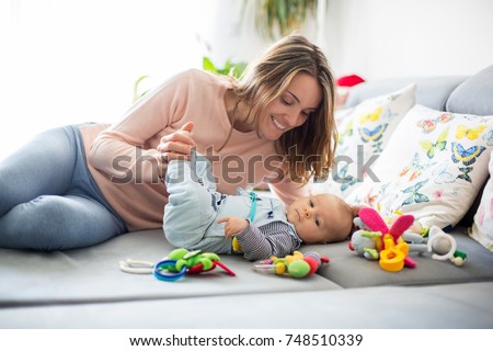 Similar – Image, Stock Photo Kid grabs his toy Child