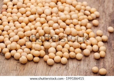 Dry soybeans on wooden board