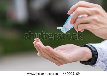 Similar – Image, Stock Photo doctor man using alcohol disinfectant gel. using protective mask and gloves during corona virus covid 2019 pandemic. Health care and medical concept