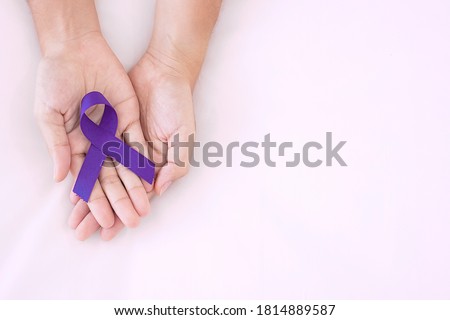 Pancreatic Cancer, world Alzheimer, epilepsy, lupus and domestic violence day Awareness month, Woman holding purple Ribbon for supporting people living. Healthcare and World cancer day concept 商業照片 © 