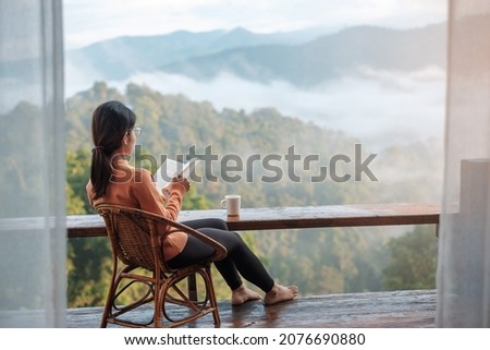 Similar – Image, Stock Photo Woman reading book near candles