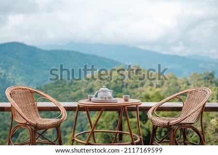 Similar – Foto Bild Zwei Stühle und ein Couchtisch unter einer Palme