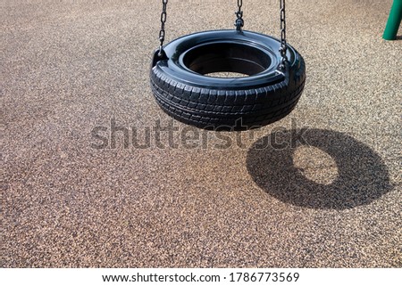 Similar – Image, Stock Photo black chain Tire Swing at a children’s  play ground no people