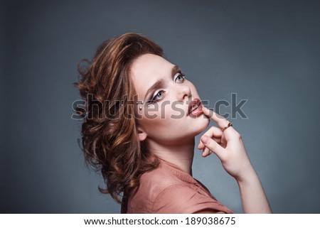portrait of a girl with voluminous hair. professional make-up