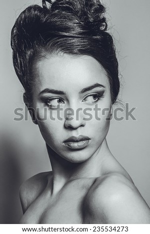 Black and white photos of a beautiful girl with beautiful hair, beautiful eyes, lips, interesting hairstyle