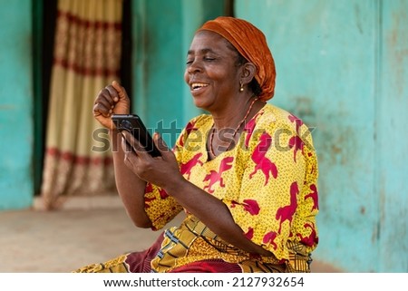 Similar – Image, Stock Photo Delighted black woman browsing smartphone near car