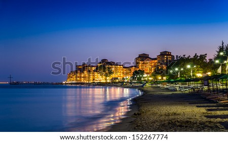 Illuminated Elenite at night, beach, hotels, sea, plank beds, umbrellas