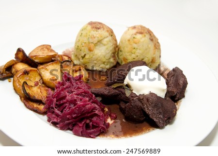Venison goulash with dumplings, red cabbage and oyster mushrooms