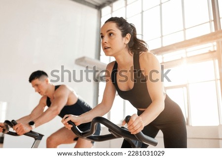 Image, Stock Photo Active sporty couple riding mountain bikes on demanding forest trail.