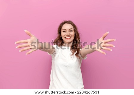 Similar – Image, Stock Photo Positive girl with outstretched hand looking at camera