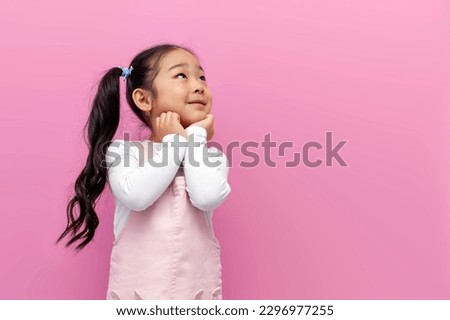 Similar – Image, Stock Photo Pretty brunette, long-haired young woman, teenager, teenager smiles naturally into the camera, in front of a grey wall on vacation. Happy girl with blue eyes, in front of a rock by the sea, on the beach during the summer holidays, looking forward to holidays and summer fun.