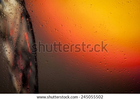 look at the water pouring through the glass with raindrops
