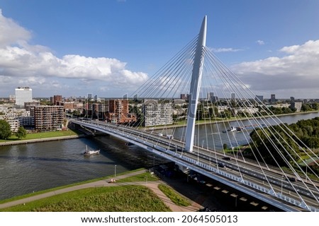 Prins Clausbrug cable bridge city access to Utrecht industrial area with the residential neighbourhood and cargo vessel in the foreground. Aerial of infrastructure and Dutch urban transportation Imagine de stoc © 