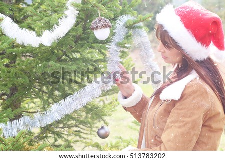 Beautiful girl holding a Christmas decoration