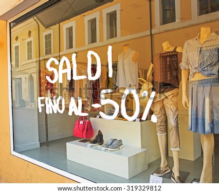 The white words FINAL SALE on Italian on the shop window