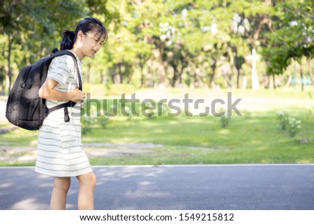 Similar – Image, Stock Photo Teenager girl with backpack and bike standing on metro station holding smart phone in hand, scrolling and texting, smiling and laughing. Futuristic bright subway station. Finland, Espoo