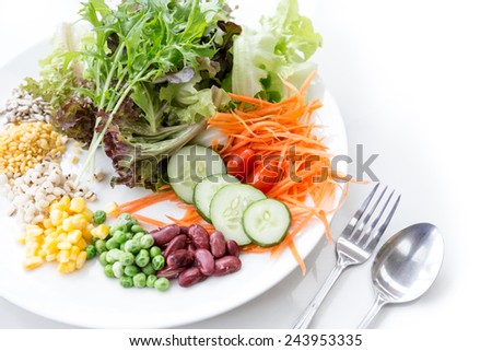 cereal salad with vegetables in a white dish