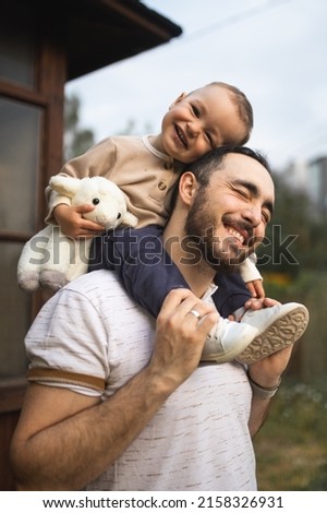 Similar – Image, Stock Photo Father and son playing with toy railway and train. happy family spending time together. Dad and son.