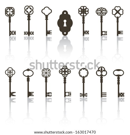 Collection of antique keys, keyhole with shadows. All objects grouped separately.