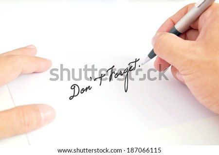 Man\'s holding pen with white paper , Writing \