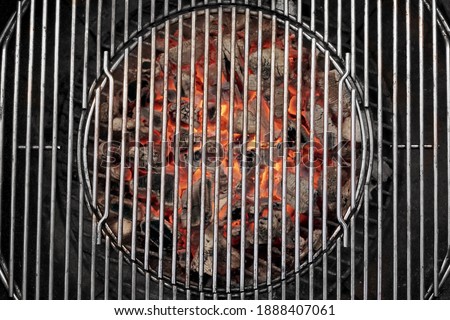 Kettle Grill Pit With Flaming Charcoal. Top View Of BBQ Hot Kettle Grill With Stainless Steel Grid, Isolated Background, Overhead View. Barbecue Kettle Grill On Backyard Ready Grilling Cookout Food.