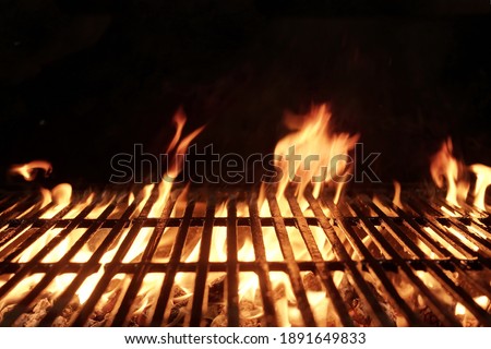 Empty Flaming BBQ Charcoal Grill. Hot Barbeque Grill Ready Cooking Food On Cast Iron Grate. Concept For Cookout, Barbecue Party At Garden Or Backyard. Grill With Bright Flames Black Isolated.