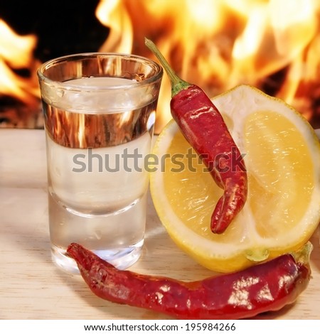 Vodka, Pepper, Lemon on Fire Background
