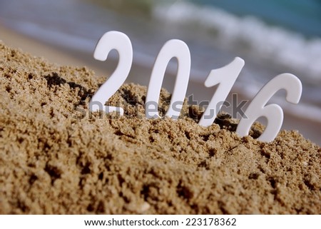 2016 New Year numbers on the sea beach. Background and Texture for text or image