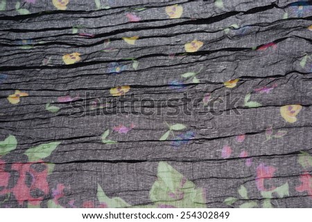 Abstract Black Background Wavy Folded Textured Fabric or Material  or Cloth Background With Floral Pattern