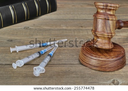 Judges Gavel,  Law Book,  Medical And Narcotic Drugs On Grunge Wood Table