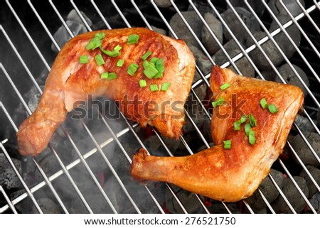 Barbecue Roast And Smoked Chicken Quarters On The Hot Charcoal Grill Background. Good Food For Outdoor Summer Barbecue Party Or Picnic