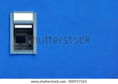 ATM Or ABM Or Cashpoint Machine Or Hole In The Wall Byilt-In The Blue Concrete Wall Textured Background With Copy Space