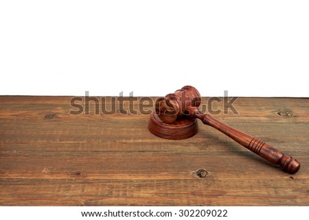 Judges Or Auctioneers Wood Rough Desk With Gavel On The Sound Board Isolated On White Background With Copy Space. Judicial System Concept