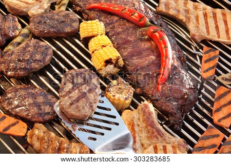 BBQ Spareribs, Steaks, Hamburger Patties, Corn And Pepper On The Hot Charcoal Grill. Cookout Food For Summer Weekend Picnic, Outdoor Dinning Or Party.