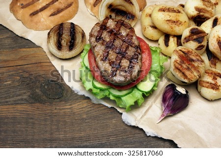 Picnic Table Top With BBQ Grilled Burgers And Vegetables, Outdoor Dinner Concept, Overhead View