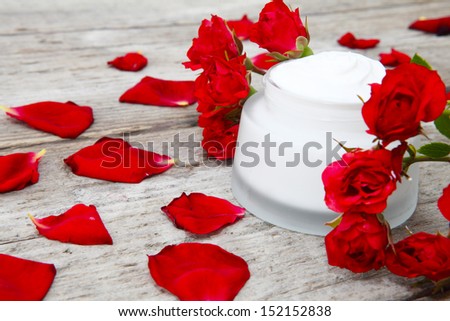 Rose cream and rose petals