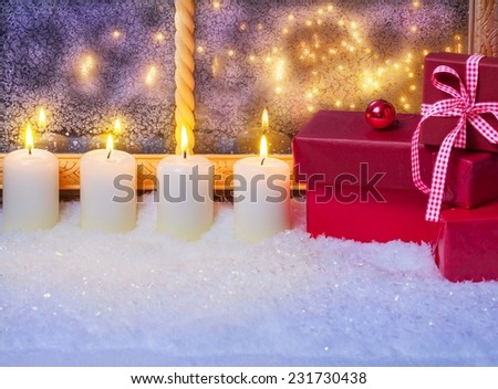 Gifts and candles in the window