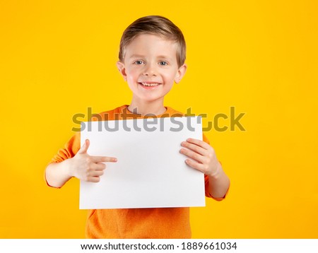 Similar – Image, Stock Photo Cute boy holds on to the horizontal bar and looks at the camera